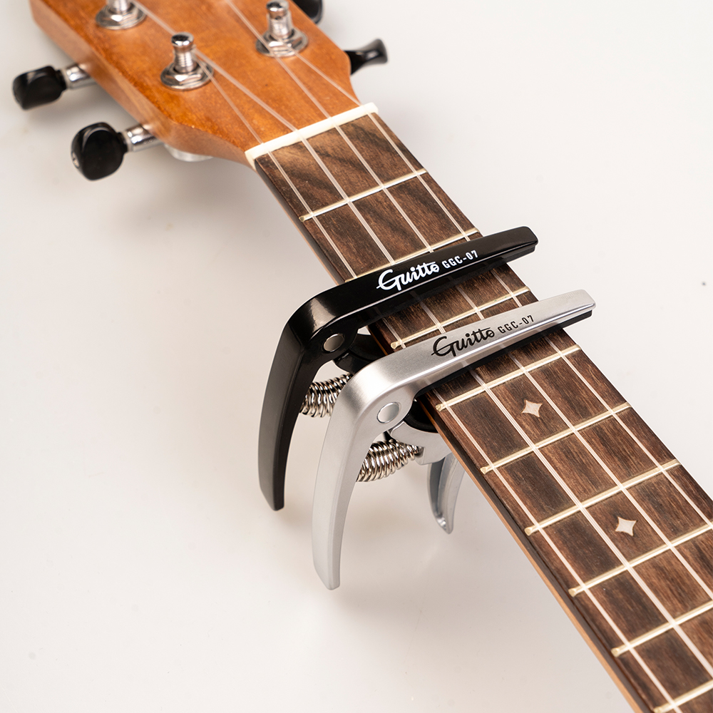 GUITTO GGC-07 Ukulele Capo Qui - Musical Instruments Easy ulasan dan harga