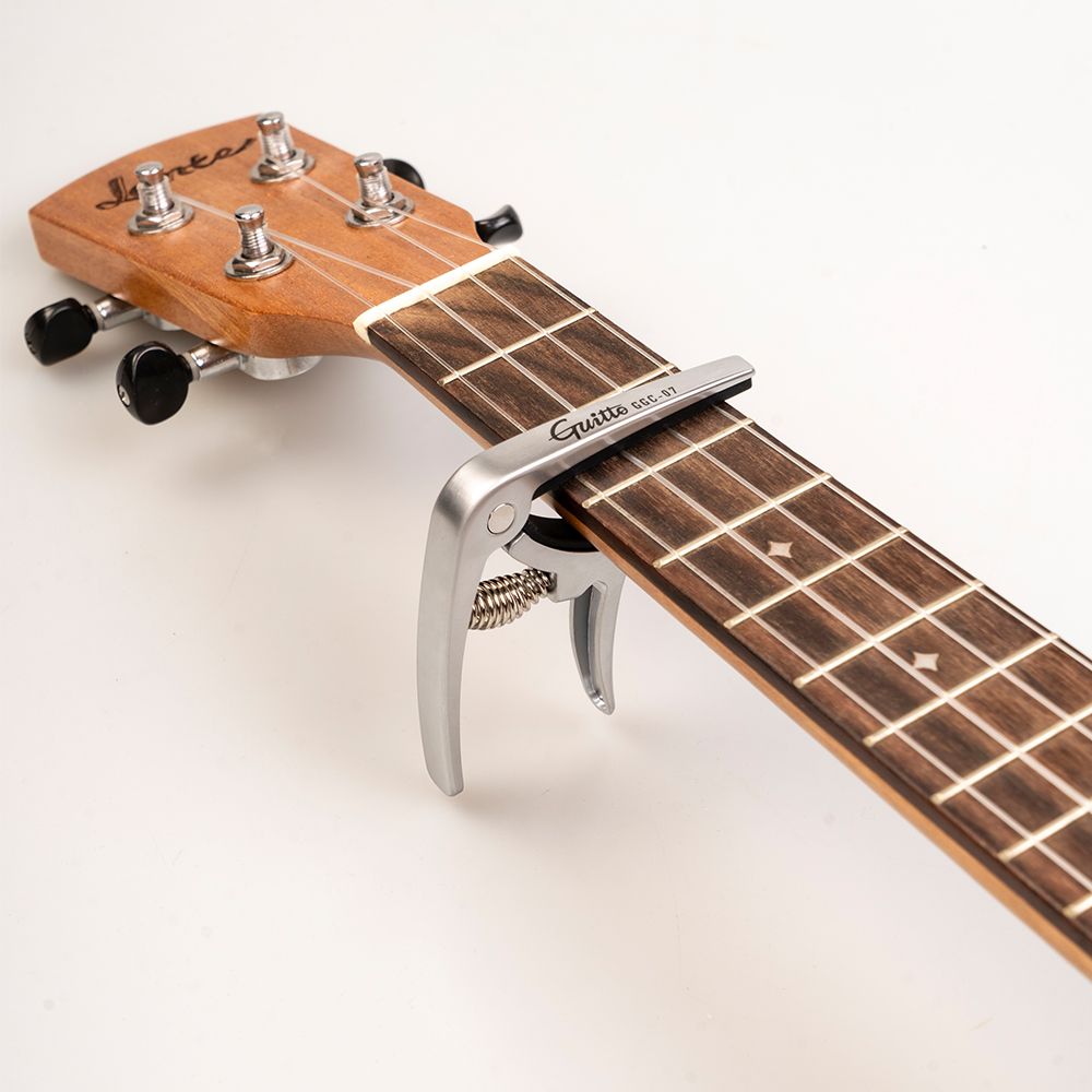 GUITTO GGC-07 Ukulele Capo Qui - Musical Instruments Easy ulasan dan harga